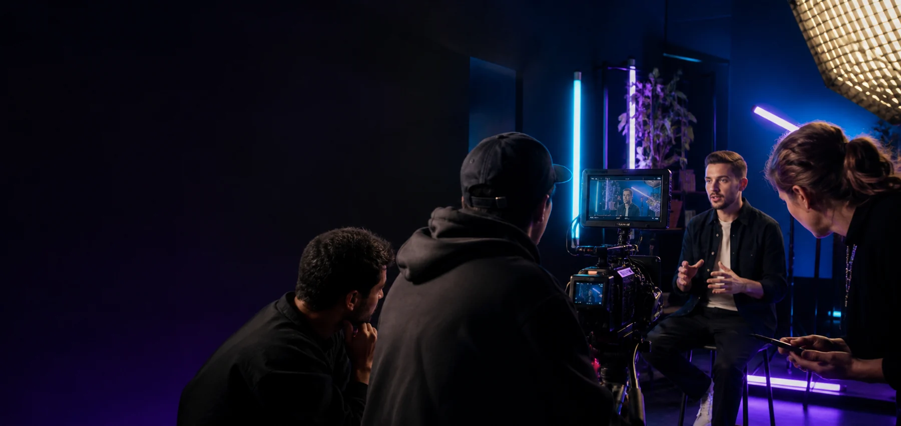 RTG production crew filming a business founder in a professional studio